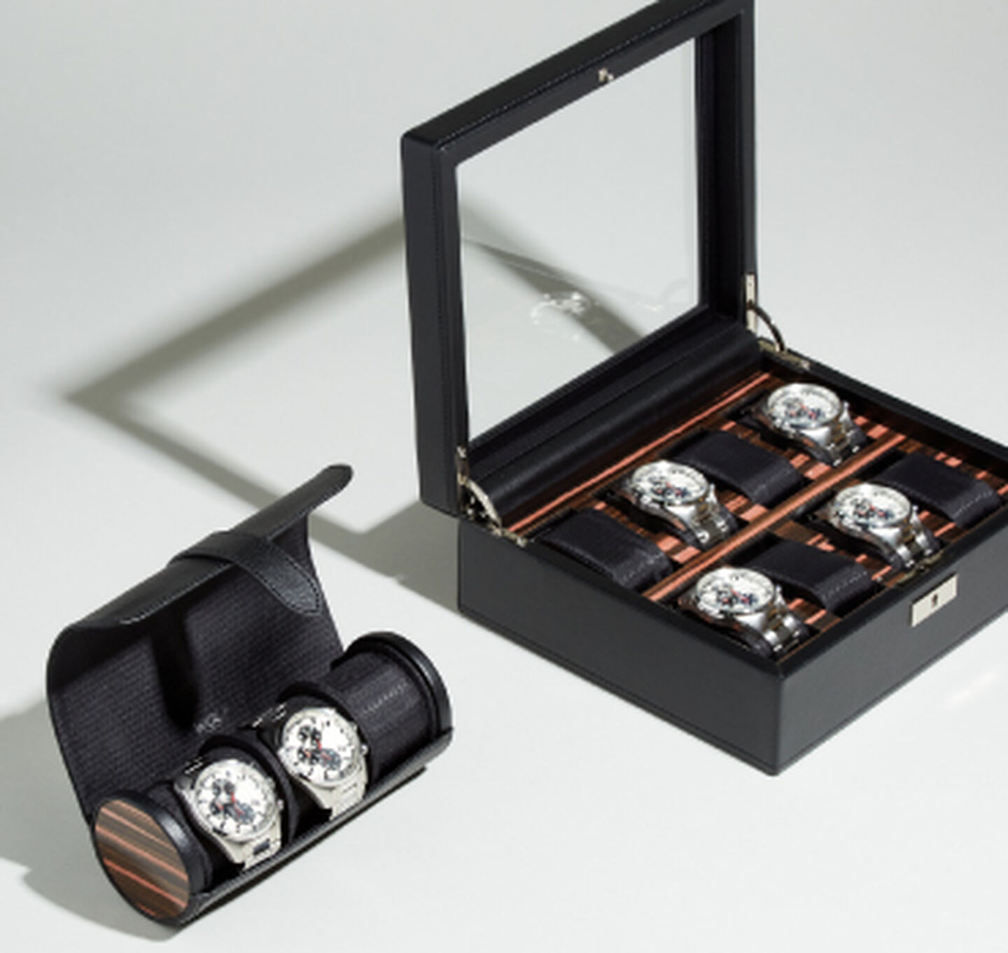 A WOLF watch roll and box.